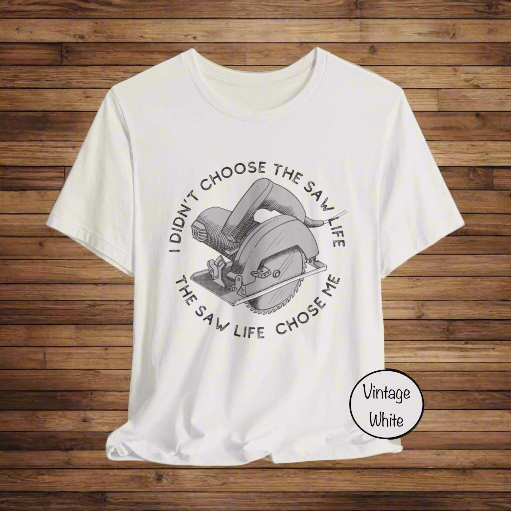 White t-shirt with circular saw graphic and text on a white background
