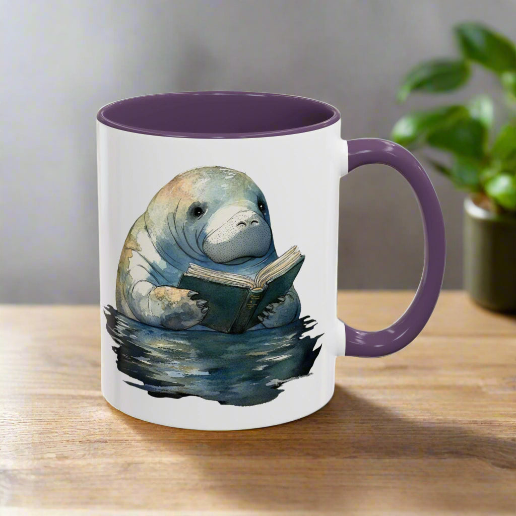 Mug with a manatee reading a book design on a white background