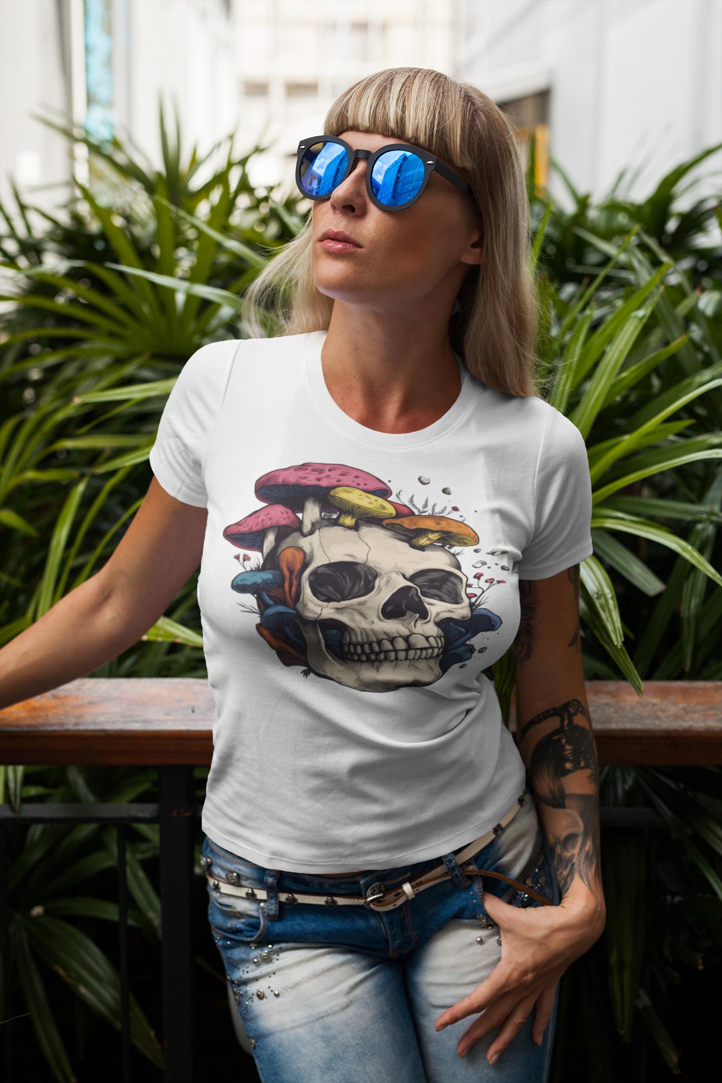 Woman wearing a white t-shirt with a colorful skull design, standing outdoors with plants in the background.