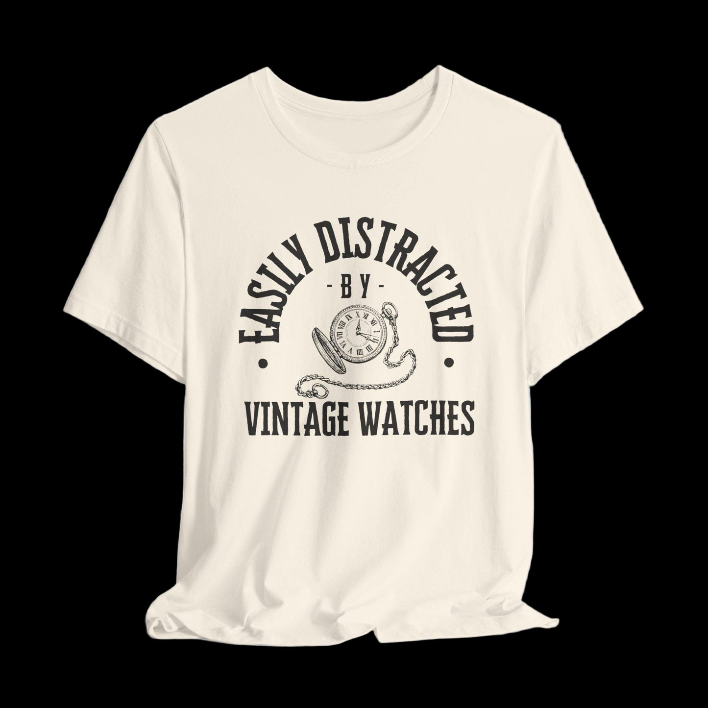 Beige t-shirt with black text and graphic on a black background