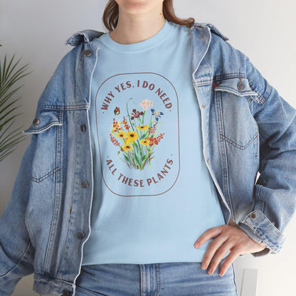 Person wearing a light blue t-shirt with floral design and text, paired with a denim jacket.