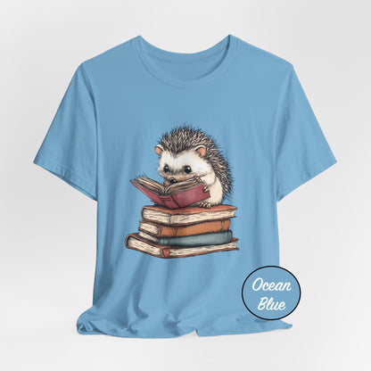 Blue t-shirt with a hedgehog reading a book design on a light gray background