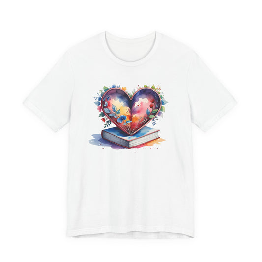 White t-shirt with a colorful design of a heart, book, and flowers on a white background