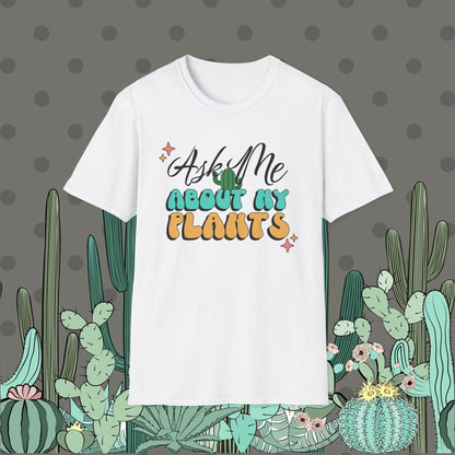 White t-shirt with 'Ask Me About My Plants' text on a polka dot background with cacti illustrations.