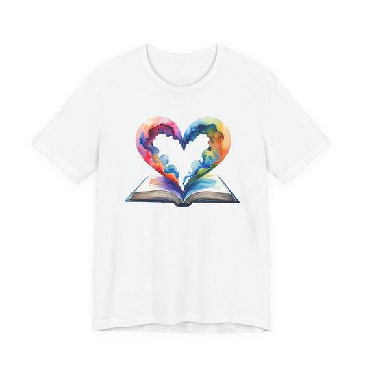 White t-shirt with a colorful heart design on an open book