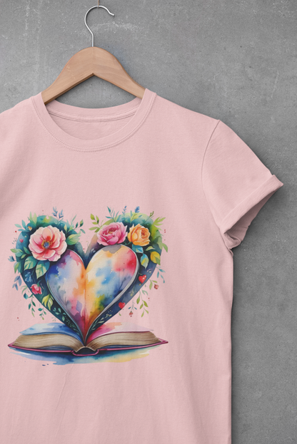 Pink t-shirt with a colorful heart design on a hanger against a gray background