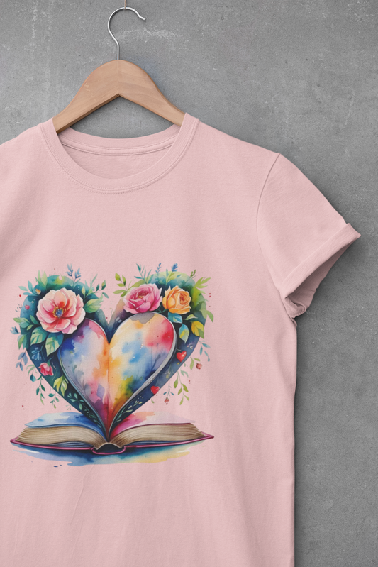 Pink t-shirt with a colorful heart design on a hanger against a gray background