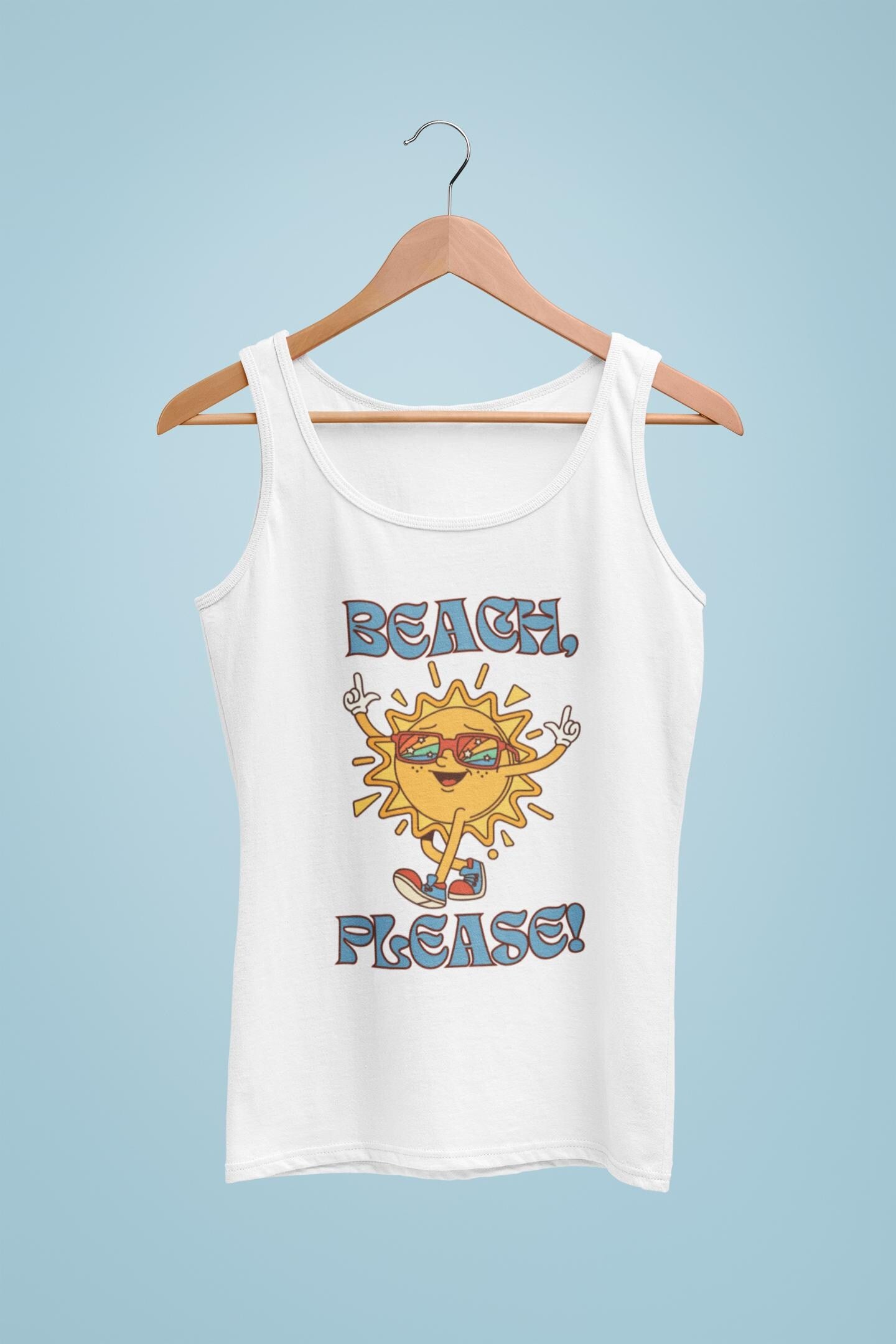 White tank top with a sun graphic and 'Beach Please!' text on a hanger against a light blue background