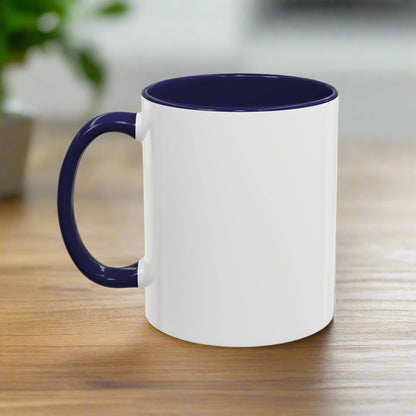 White mug with a navy handle and interior on a white background