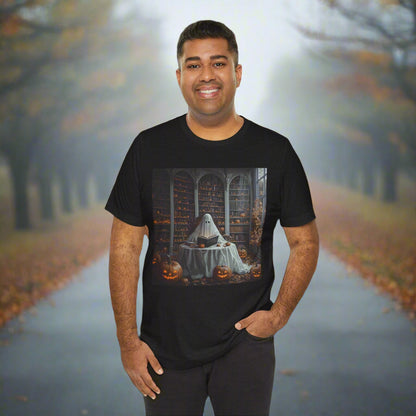 Man wearing a black t-shirt with a graphic design, standing in front of an autumn-themed background with trees and animals.