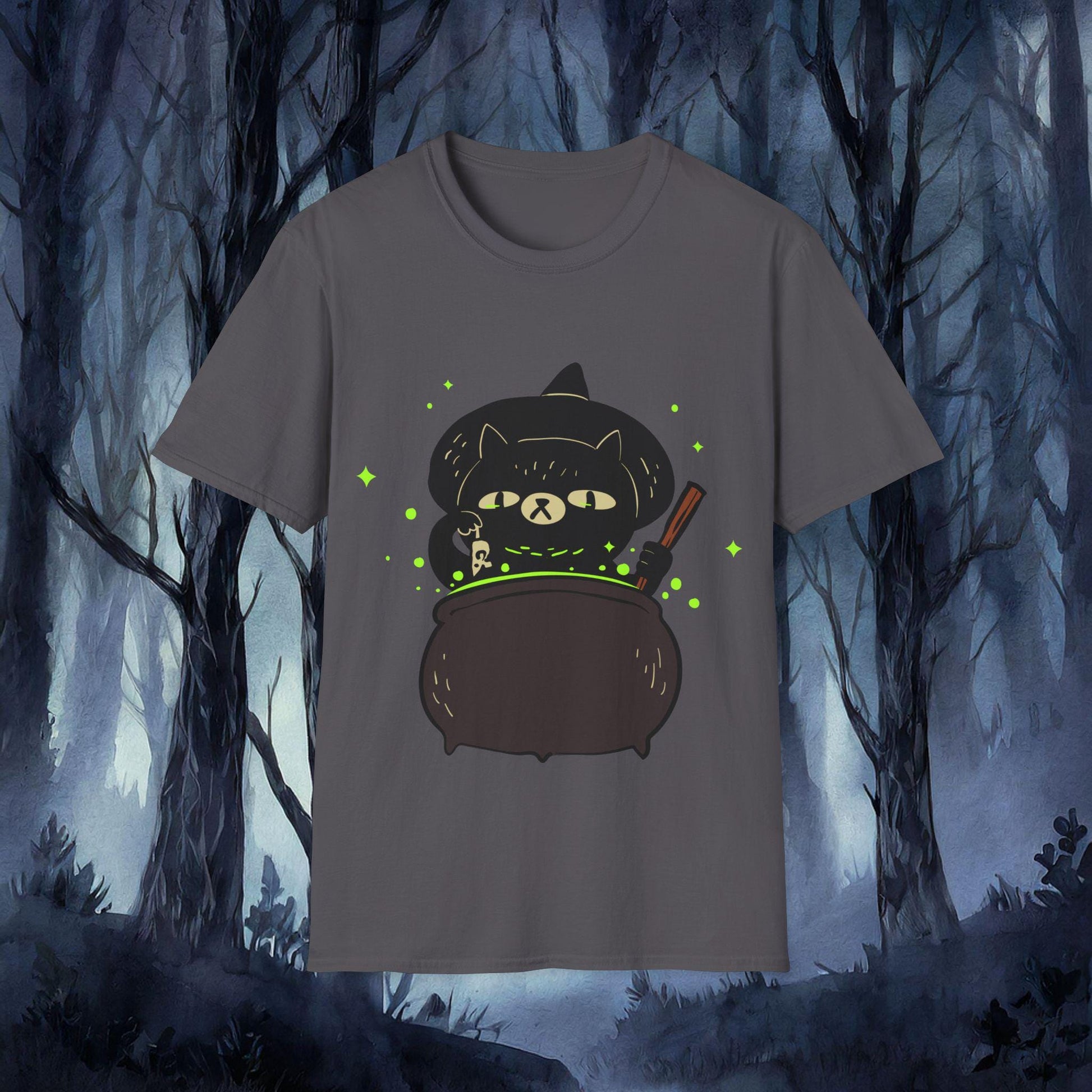 Gray t-shirt with a black cat in a witch hat and cauldron graphic against a dark forest background.