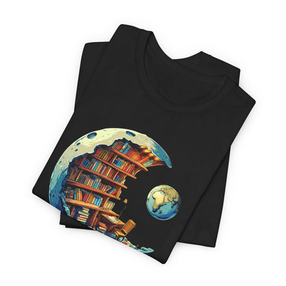 Black t-shirt with a colorful design of books on a moon and Earth, folded on a white background