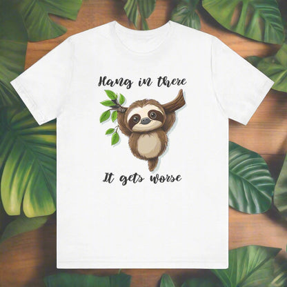 White t-shirt with a sloth graphic and text on a black background