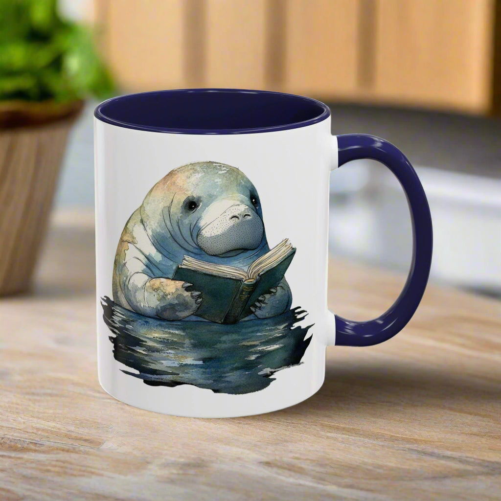 Mug with a manatee reading a book design on a white background