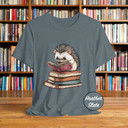 Heather slate t-shirt with a hedgehog reading a book graphic on a light gray background