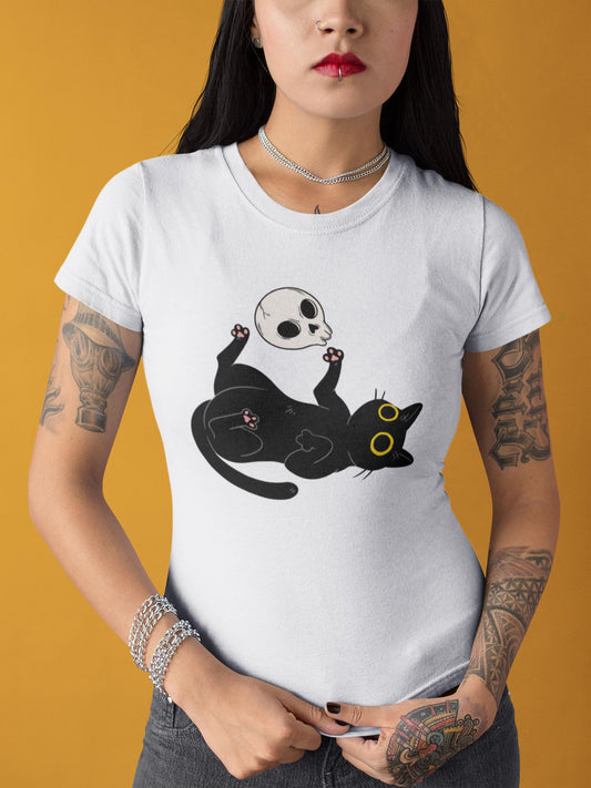 Person wearing a white t-shirt with a black cat and skull design on a yellow background