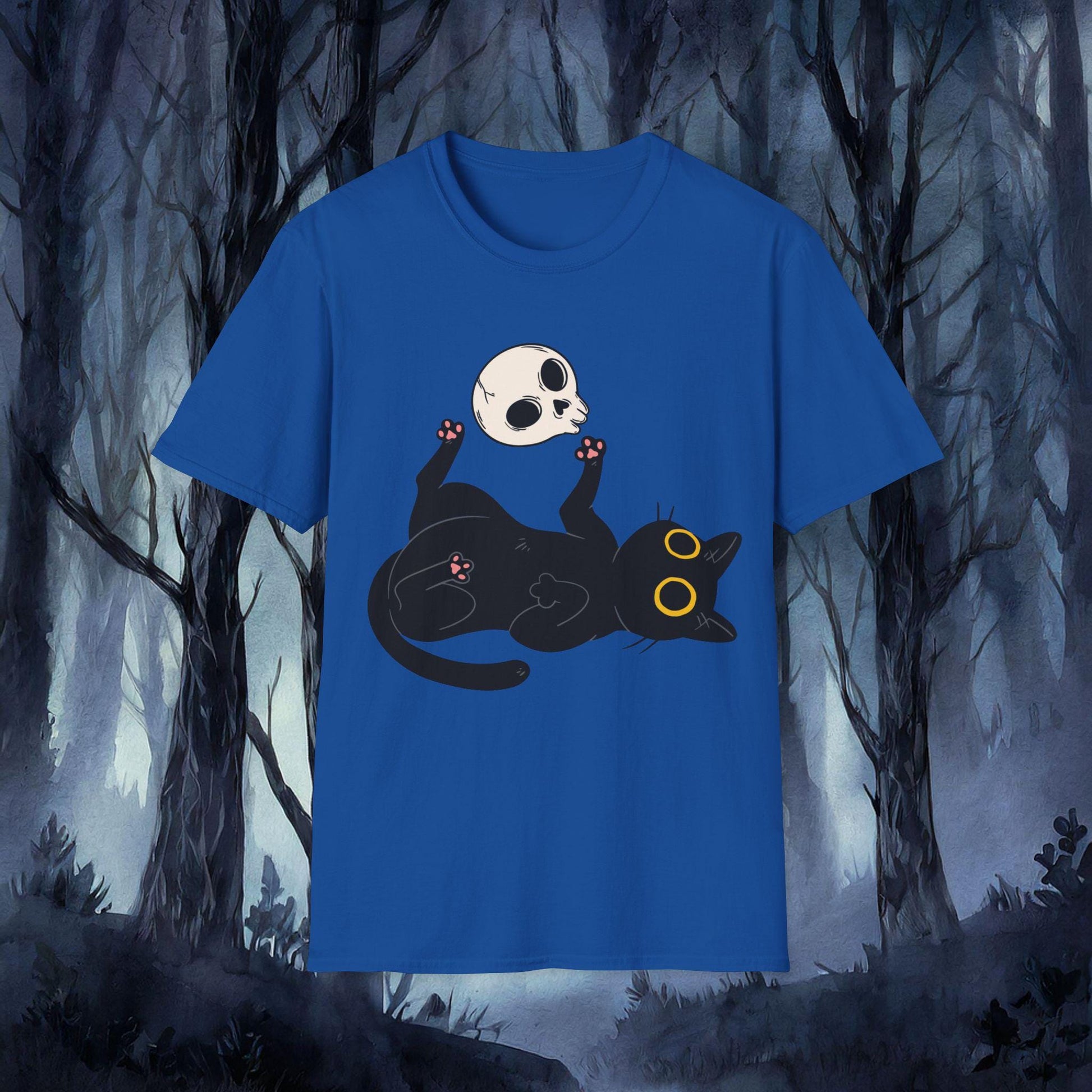 Blue t-shirt with a black cat and skull design against a forest background