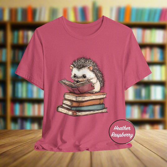 Pink t-shirt with a hedgehog reading a book design on a white background