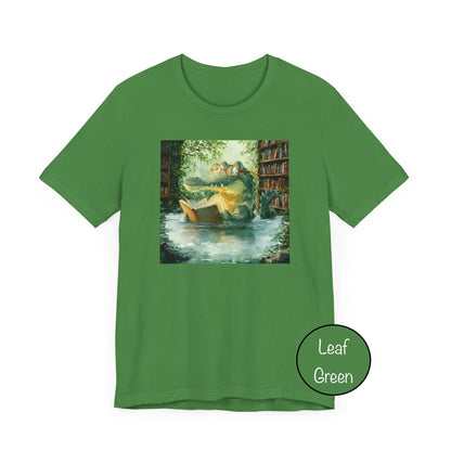 Green t-shirt with a printed design of a boat on water and trees, labeled 'Leaf Green'.