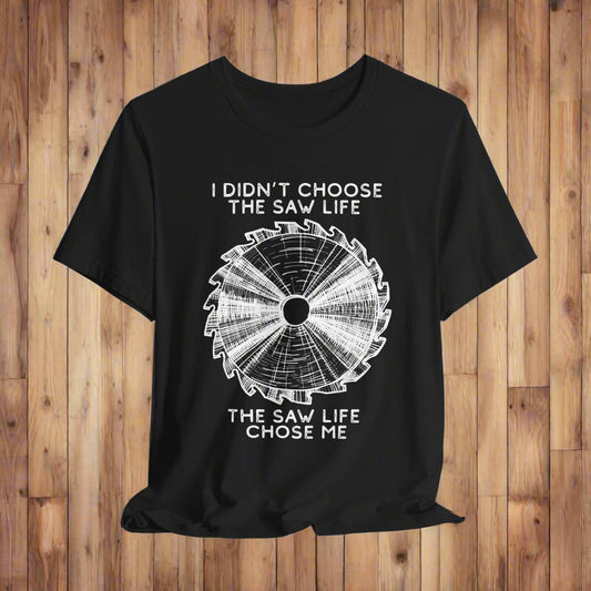 Black t-shirt with white saw blade graphic and text on a light gray background