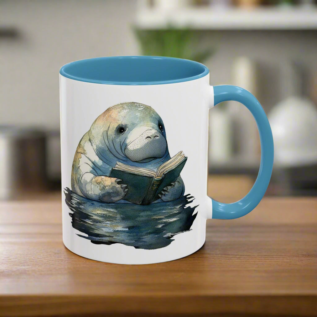 Mug with a manatee reading a book design on a white background
