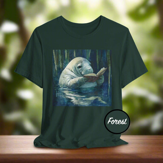 Dark green t-shirt with a manatee reading a book in a forest design, labeled 'Forest'.