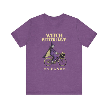 Purple t-shirt with a witch riding a bike graphic and text on a white background