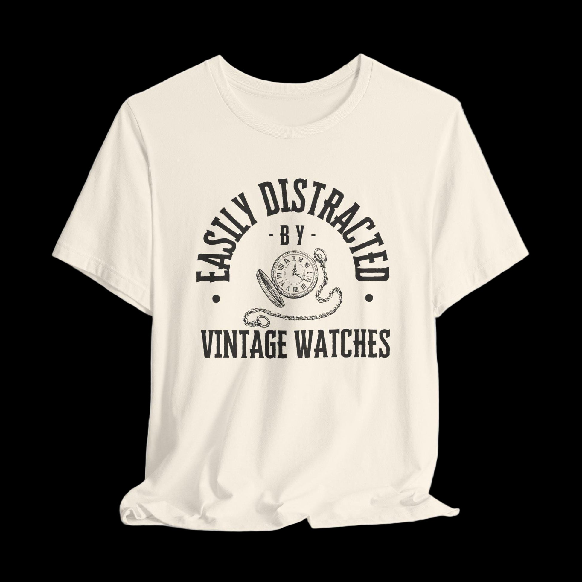 Beige t-shirt with black text and graphic on a black background