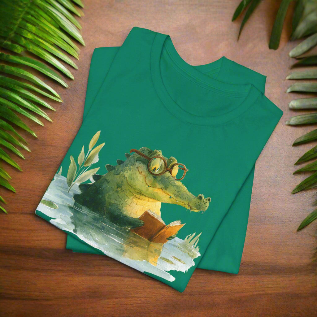 Green t-shirt with a crocodile reading a book design on a white background
