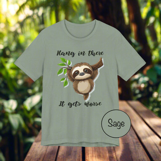 Sage green t-shirt with a sloth graphic and text on a white background
