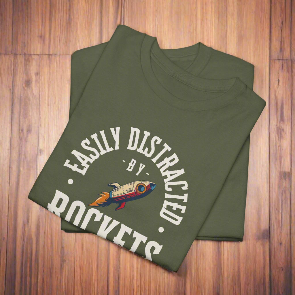 Folded green t-shirt with a graphic and text on a white background