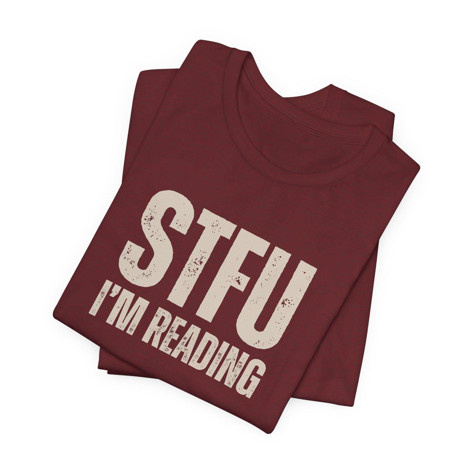 Maroon t-shirt with 'STFU I'm Reading' text on a white background