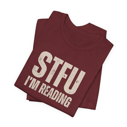 Maroon t-shirt with 'STFU I'm Reading' text on a white background