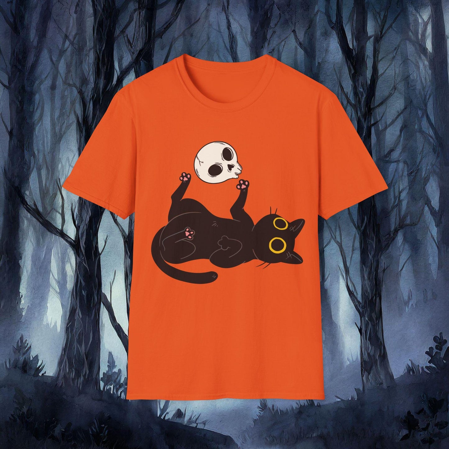 Orange t-shirt with a black cat and skull design against a dark forest background