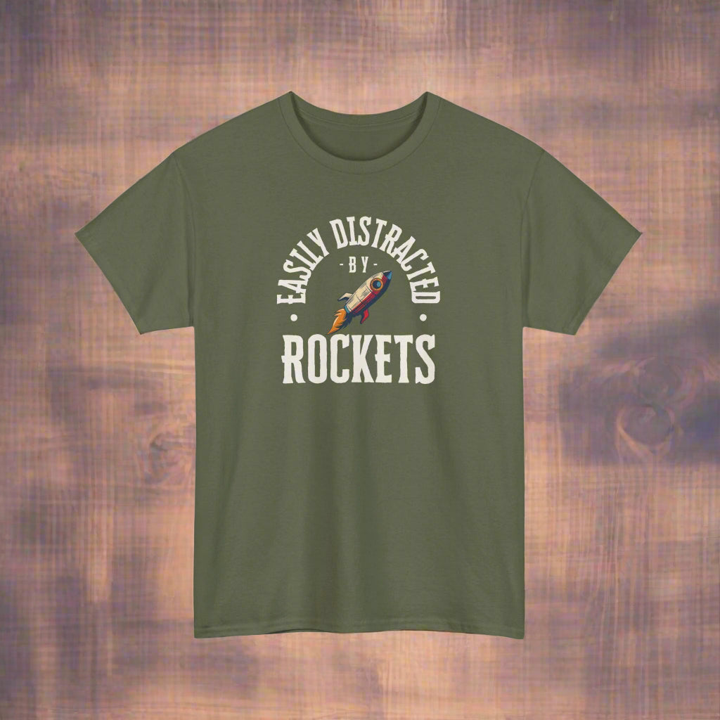 Green t-shirt with 'Easily Distracted by Rockets' graphic on a white background