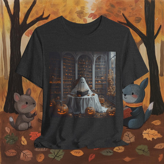 Black t-shirt with a ghost reading a book design on a Halloween-themed background with pumpkins and leaves.