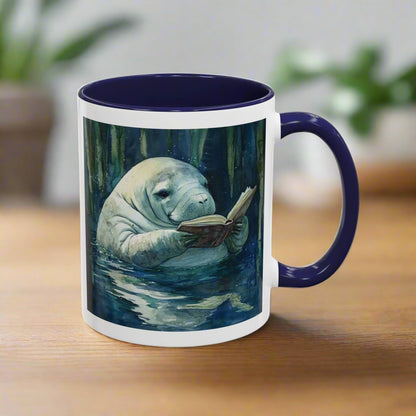 Mug with a design of a manatee reading a book in a forest setting.